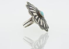 Beautiful Handcrafted Native American Flower Shaped Ring with a Beautiful Natural Turquoise in The Center. Size: 6 Dimensions: Length: 33mm Width: 27mm Material: .925 Silver, Natural Turquoise Unique Turquoise Flower Jewelry, Turquoise Flower-shaped Jewelry For Wedding, Turquoise Flower Jewelry For Wedding, Turquoise Flower-shaped Wedding Jewelry, Adjustable Turquoise Flower Ring Gift, Native American Turquoise, Turquoise Flowers, American Turquoise, Natural Turquoise