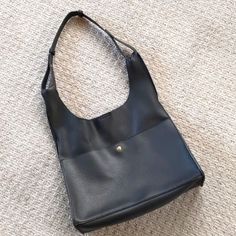 Incredible Leather Look, Mid-Size Black Slouchy Shoulder Bag W/Gold Hardware. This Bag Is New Without Tags And In Perfect Condition! Perfect For Larger Bag Trend, But Still Very Classic For Any Style! This Bag Is Made Of A Leather Look Synthetic That Is Ultra Soft And Slouchy. Sueded Interior Give This A Very Expensive Look And Feel. Two Inner Pockets For Additional Storage. Perfect Piece For The Hobo Bag Revival. Classic Color With Gold Hardware Make This Coordinate Well With Any Wardrobe. Black Hobo Satchel For Errands, Black Shoulder Bag With Snap Closure For Office, Office Black Soft Leather Hobo Bag, Versatile Black Hobo Bag For Office, Everyday Faux Leather Bags With Snap Closure, Everyday Black Satchel With Snap Closure, Black Bags With Snap Closure For Errands, Black Hobo Bag With Snap Closure For Travel, Black Shoulder Bag With Snap Closure For Errands