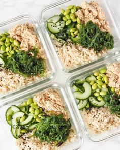 four glass containers filled with rice and vegetables