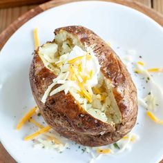 baked potatoes with cheese on top and the words easy air fryer baked potatoes