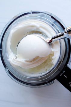 an ice cream in a blender with a spoon