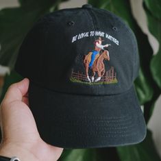 This Cowboy themed embroidered cap is inspired from playing Read Dead Redemption 2 lately. Be Loyal to What Matter is a quote from the protagonist in RDR2, Arthur Morgan. A great gift or piece for everyday wear. Direct embroidery, only available here at Embroidered Dad Hats! 🧢• Embroidered on a cotton dad hat.• Adjusts up to 24" in circumference.• Unstructured and low profile fit.• Free poly-bag shipping in 🇺🇸 (more options at checkout). Cheap Embroidered Dad Hat With Curved Visor, Cheap Sports Dad Hat With Embroidered Logo, Cheap Casual Dad Hat With Embroidered Logo, Cheap Embroidered Logo Dad Hat For Summer, Cheap Dad Hat With Embroidered Logo, Cheap Summer Dad Hat With Embroidered Logo, Trendy Embroidered Dad Hat At Cheap Price, Cheap Spring Dad Hat With Embroidered Logo, Cheap Embroidered Logo Dad Hat