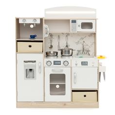 a toy kitchen with white appliances and wooden cabinets on display in front of a white background