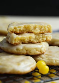 a stack of cookies sitting on top of a cooling rack next to yellow candies