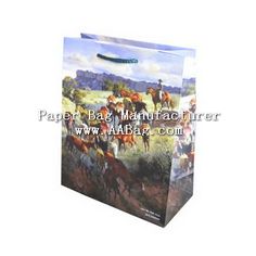 a paper bag with an image of horses and people on the field in front of it