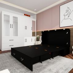 a black bed sitting in the middle of a bedroom