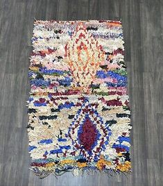 a multicolored rug on the floor