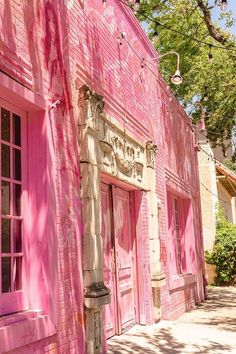 a pink building that has been painted to look like it is being used as a restaurant