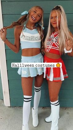 two girls dressed in cheerleader outfits standing next to each other