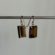 Distinguished facets join forces with a deep amber color in these elegant quartz earrings. 18k yellow gold Quartz 12mm x 16mm (1/2" x 5/8")Earrings hang 1 1/8" from the ear Each earring weighs 3g Modern Octagon Earrings For Formal Occasions, Gold Faceted Earrings For Evening, Formal Amber Citrine Earrings, Classic Faceted Yellow Gold Earrings, Classic Faceted 14k Gold Earrings, Classic 14k Gold Faceted Earrings, Classic Brown Jewelry With Matching Earrings, Modern Amber Earrings For Formal Occasions, Modern Amber Earrings For Formal Events