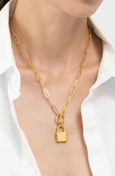 An elegant water-resistant 14-karat gold-plated paper-clip chain necklace suspends a lock pendant with a toggle clasp for contemporary style. 18" length; 1" L x 0.5" W pendant Toggle closure This piece of jewelry is water-resistant and will not tarnish with water contact 14k-gold plated stainless steel Imported Gold Padlock Chain Necklace, Gold-tone Toggle Necklace With Gold Chain As Gift, Gold-tone Toggle Necklace Gift, Gold-tone Toggle Chain Necklace Gift, Gold-tone Toggle Chain Necklace For Gifts, Paperclip Chain Toggle Necklace As Gift, Gold Toggle Necklace With Paperclip Shape, Gift Gold Chain Toggle Necklace, Gold Chain Link Toggle Necklace Gift