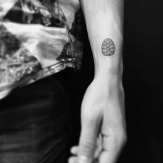 a person with a small tattoo on their arm