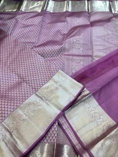 Experience the elegance and luxury of our Pastel Purple thilakam brocade pure Kanchipuram Silk Saree! This handloom saree features intricate pure zari work, adding a touch of opulence to your wardrobe. Made with the finest quality silk, this saree is a must-have for special occasions. Elevate your style with this timeless piece. Comes with Stitched blouse size 38-46 This saree is ready to wear with fall and pico done.  SILK MARK CERTIFIED Elegant Purple Churidar With Pallu, Elegant Purple Banarasi Silk Sets, Elegant Designer Churidar With Zari Weaving, Elegant Cotton Silk Churidar With Self Design, Elegant Banarasi Silk Churidar For Designer Wear, Cotton Silk Churidar With Self Design For Wedding, Wedding Cotton Silk Churidar With Self Design, Elegant Tissue Silk Salwar Kameez With Zari Weaving, Elegant Salwar Kameez With Zari Weaving In Tissue Silk