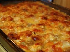 a casserole dish with meat and cheese on it