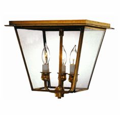 an old fashioned light fixture with three lights