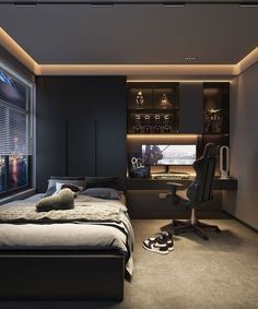 a bedroom with a bed, desk and chair in front of a window that is lit up