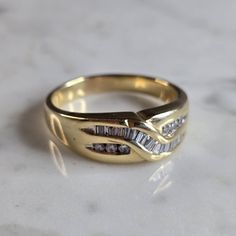 A Mens Vintage Estate 14k Yellow Gold Diamond Ring. There Are 0.45cts Of Diamonds. The Total Weight Is 10.2g, And Is A Size 13.25. The Width Of The Ring Is 5/16". Any Questions Please Dont Hesitate To Ask. Be Sure To Check Out Some Of Our Other Great Items Up For Sale. Thank You. Formal Yellow Gold Diamond Ring With Baguette Diamonds, Gold Cluster Ring With Baguette Diamonds For Anniversary, Formal Yellow Gold Cluster Ring With Baguette Diamonds, Classic Yellow Gold Ring With Baguette Diamonds, Classic Gold Ring With Baguette Diamonds, Classic Cluster Ring With Baguette Diamonds For Anniversary, Gold Rings With Baguette Diamonds For Anniversary, Classic Cluster Ring With Baguette Diamonds, Classic 14k Baguette Cut Diamond Ring