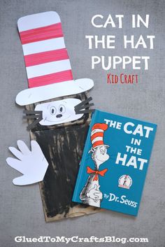 the cat in the hat puppet is next to a book and paper cut out with scissors