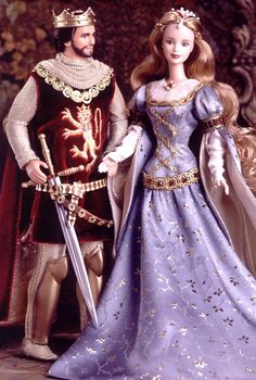 an image of a man and woman dressed in medieval costumes with swords on their hands