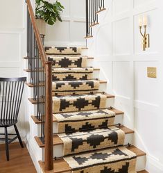 a set of stairs with rugs on them