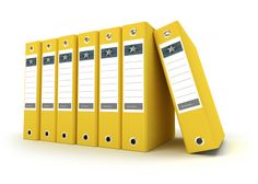 a row of yellow binders sitting next to each other on top of a white surface