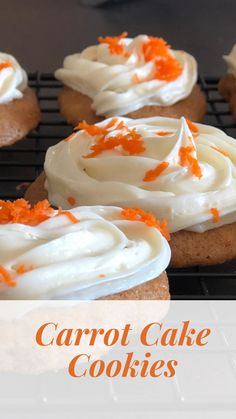 carrot cake cookies with white frosting and orange sprinkles on a cooling rack