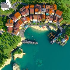 an aerial view of a small town by the water