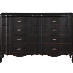 an antique dresser with drawers and metal handles