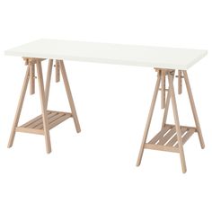 a white table sitting on top of a wooden shelf