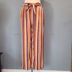 Stripe Pants With A Stylish Belted Waist Are The Perfect Pick For A Chic Weekend Look. Great For Spring. Color: Sunrise Multi - Elasticized / Elastic Waist - Waist Tie Belt - Side Slash Pockets - Wide Leg - Stripe Print - Woven Construction - Approx. 12.5" Rise, 25" Inseam (Size S) Fiber Content 100% Viscose Casual Striped Pants With Belt Loops, Multicolor Bottoms For Fall Vacation, Multicolor Fall Vacation Bottoms, Striped Spring Pants With Belt Loops, Spring Striped Pants With Belt Loops, Multicolor Tie Waist Bottoms For Spring, Multicolor Bottoms With Tie Waist For Spring, Multicolor Summer Workwear Pants, Summer Multicolor Workwear Pants