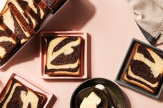 slices of chocolate and vanilla swirl bread on plates with butter cubes next to them