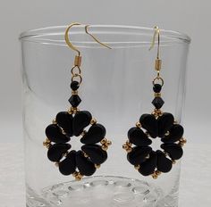 Elegant black and gold  bead woven earrings featuring jet black petite paisley beads,  golden seed beads, and jet bicone beads all woven together and finished on ear wires.   If you would like a different type of ear wire, please notify me and I can customize it for you. Ready to ship.  Petite Paisley Earring pattern courtesy of Deb Roberti (Around the Beading Table) Attention! Colors may look different depending on your monitor settings. Jewelry Care:  To keep the materials in your jewelry in good condition, do not wear while swimming, bathing, or heavily exercising. Avoid contact with abrasive or sharp objects, water, oils, lotions, perfume, chemicals, and excessive perspiration, as these things may alter bead finishes or cause damage to the materials in your jewelry. Paisley Earrings, Ear Wire, Earring Patterns, Gold Beads, Bead Weaving, Jewelry Care, Seed Beads, Lotion, Paisley