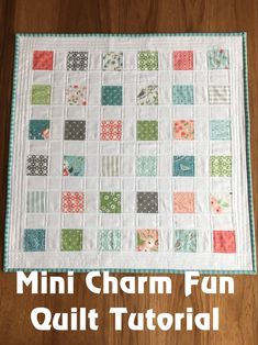 a quilted table runner with the words mini charm fun quilt pattern on it