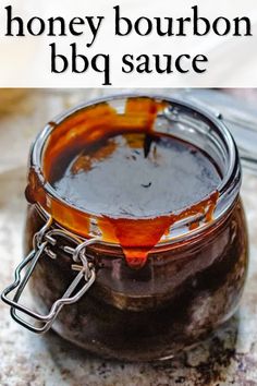 honey bourbon bbq sauce in a glass jar with the words, how to make honey bourbon bbq sauce