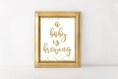 a gold framed art print with the words joy to the world