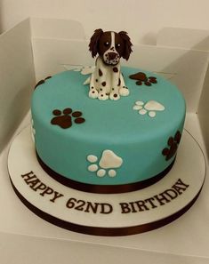 a birthday cake with a dog on top