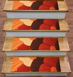 three wooden steps with colorful designs on them