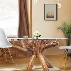 a dining table made out of wood with white chairs and flowers on the table top