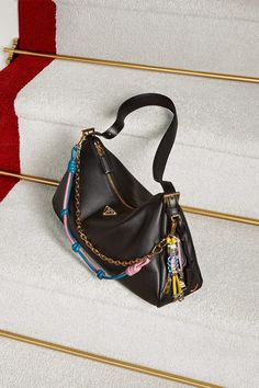 Prada's Holiday Collection captures the joy and sophistication of the season. Discover more at Lyst.