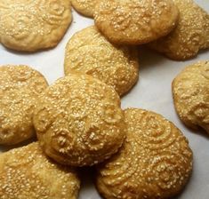 sesame cookies are arranged on a baking sheet