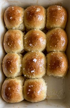 freshly baked rolls in a white baking dish