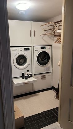 a washer and dryer in a small room