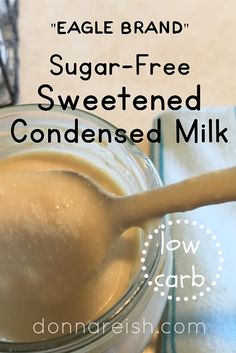 a glass jar filled with sugar - free sweetened condensed milk next to a wooden spoon