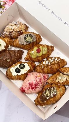 a box filled with different types of pastries