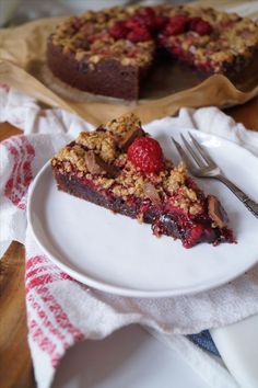 a piece of chocolate raspberry pie on a white plate