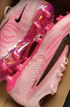 the pink nike air max is in a box with its shoe laces on it