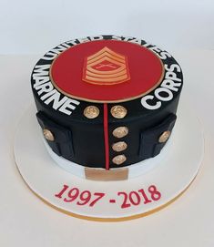 a cake that is decorated with the words marine and an image of a soldier's uniform