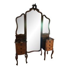 an antique dressing table with mirror and two drawers on each side is shown against a white background