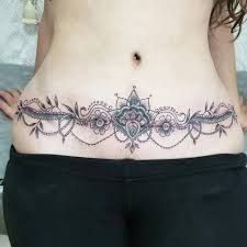 a woman with a tattoo on her stomach