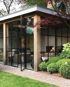 a screen shot of a small house with glass doors on the front and back sides